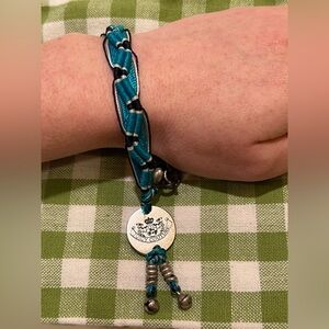 WOMEN’S JUICY COUTURE CORDED BRACELET.